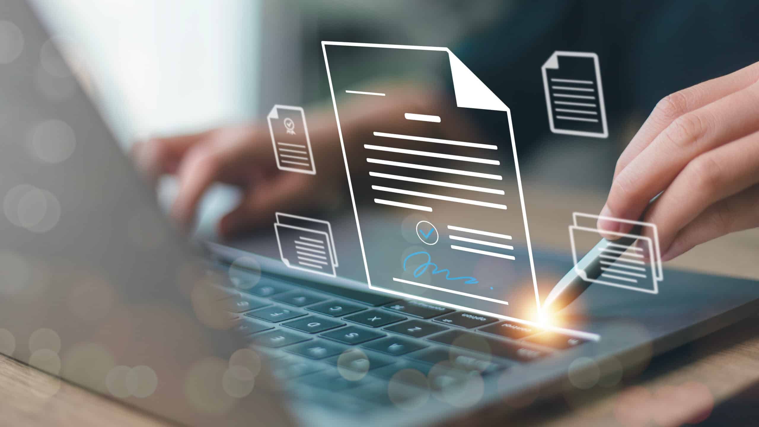 Mains tapant sur un clavier d'ordinateur portable, superposées d'icônes de documents dématérialisés dont un contrat avec signature électronique